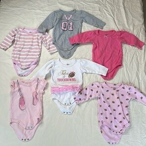 Bundle of 6 onesies. All Little Treasures brand, five long sleeve and one short